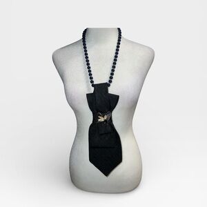 Elegant Black Tie Necklace with bird in flight brooch